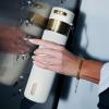 imageContigo AutoSeal 24 oz Stainless Steel VacuumInsulated Water Bottle with Leakproof PushButton Spout amp Lock Carry Strap BPAFree amp LeadFree Dishwasher SafeWild Indigo Champagne